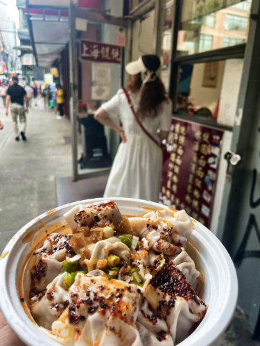 A bowl of spicy wontons outside the White Bear
