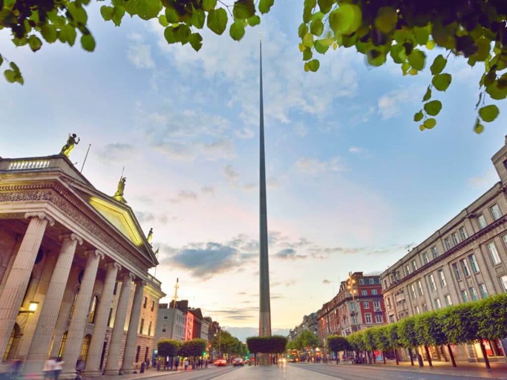 View of the iconic Spire and General Post Office on the left at O’Connell Street during sunset