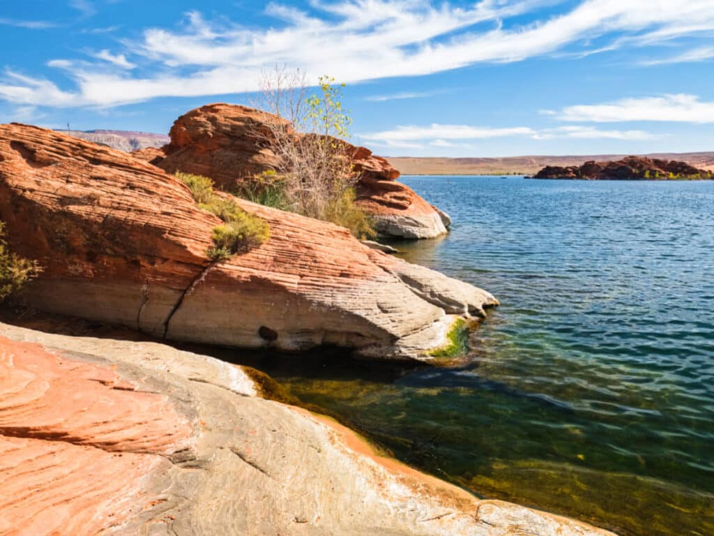Scenic view of the blue water and rock formations at the Sand Hollow State Park