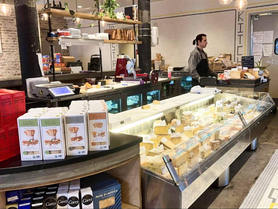 View of the wide variety of cheese displayed at St. James Cheese Company