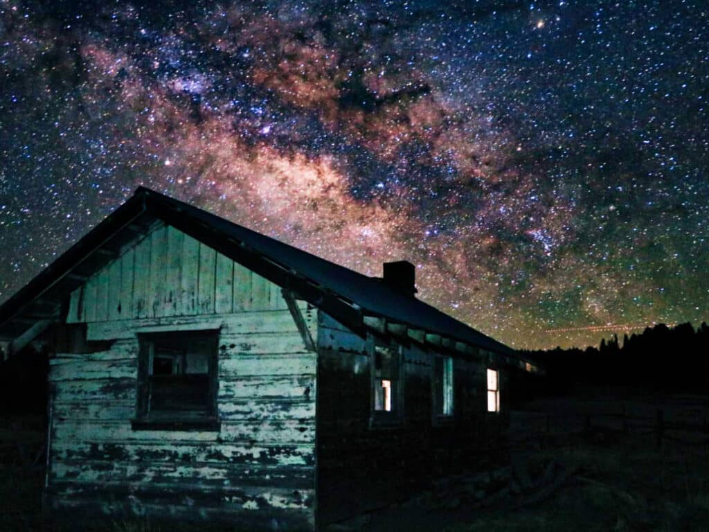 Picturesque view of the starry sky over a house in Greer
