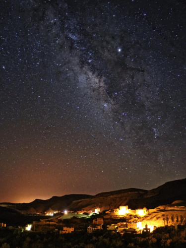 The Milky Way shining brightly over the town of Morocco at night