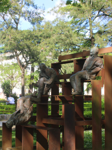 Laughing statues  at Jardim da Cordoaria