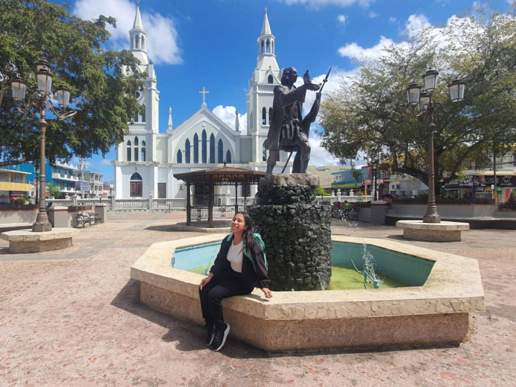 The author, Vanessa Ramos with the statue of Christopher Columbus