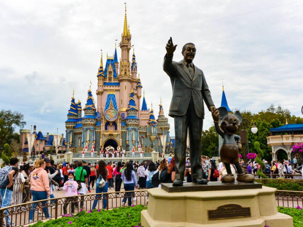 View of the statue of Walt Disney and Mickey Mouse in front of Disney's castle