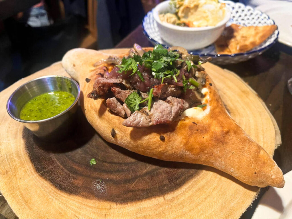 Closeup look of steak and mushroom cheese boat