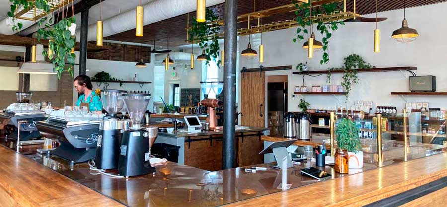 A bartender preparing a drink in Steam Espresso Bar