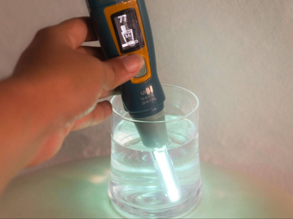 Using the Steripen on the glass of water