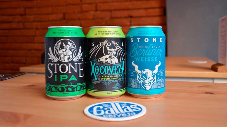 View of canned beers from Stone Brewing on a table
