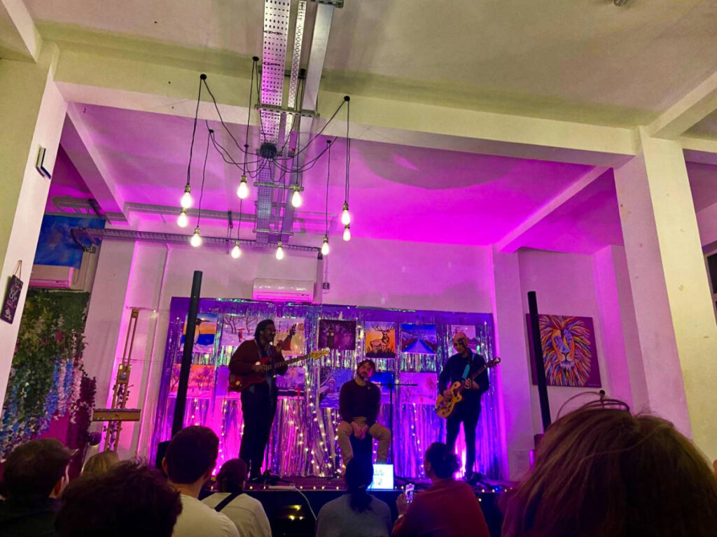 The crowd watching the Stone Jets band performing on the stage at London Sofar Sounds