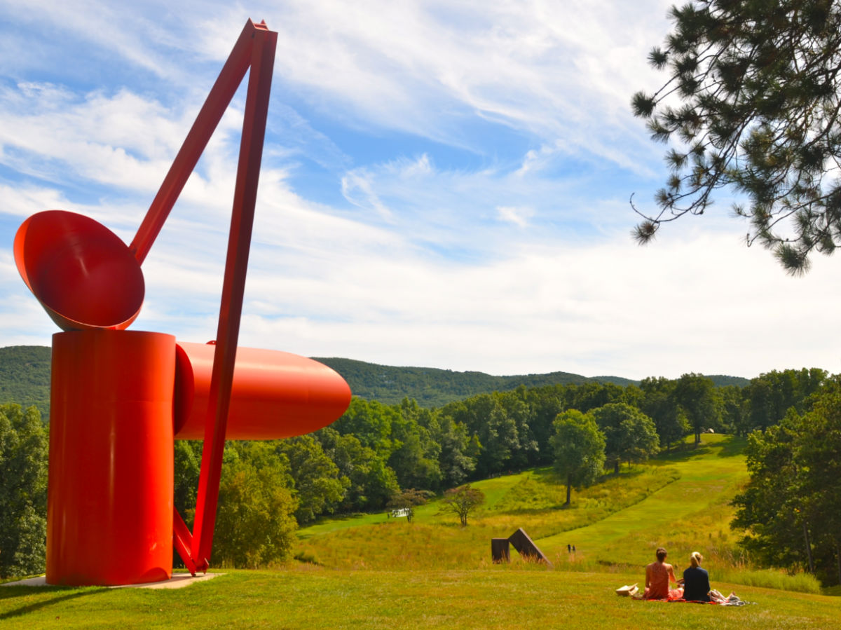 Friends having a picnic near the red structure at Storm King Art Center
