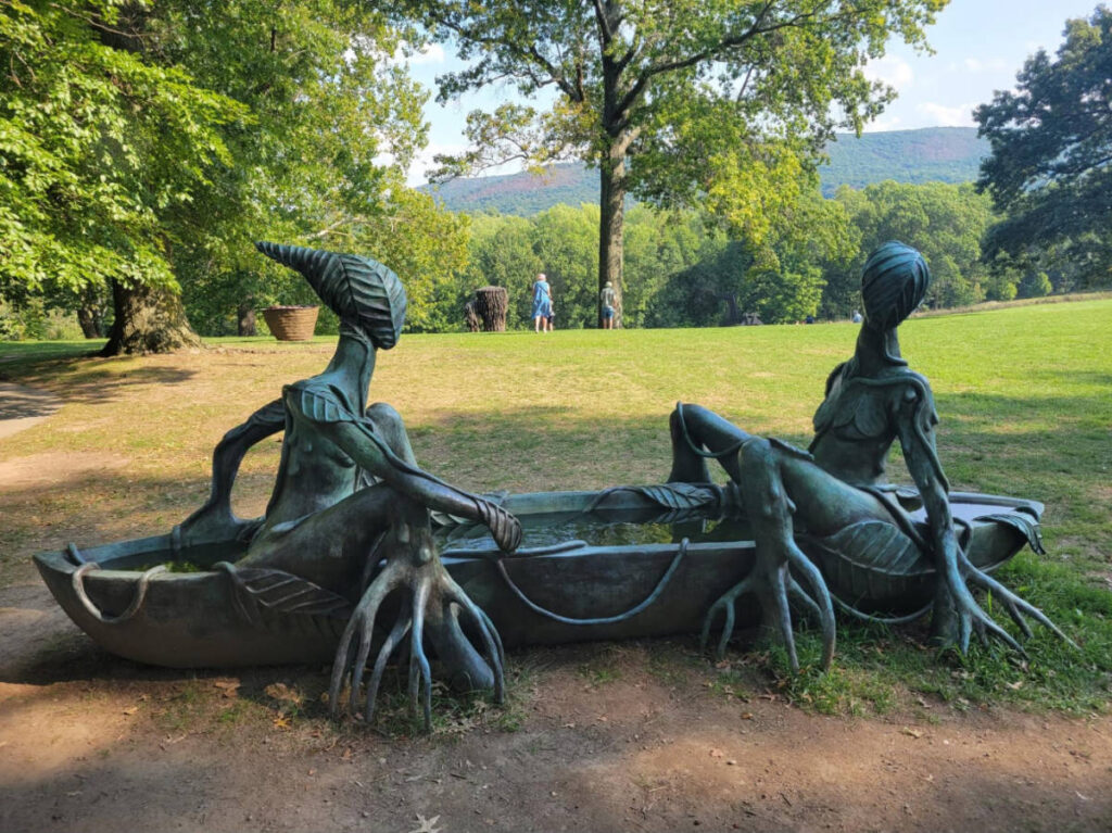 View of the sculptures with water in the middle at Storm King Art Center