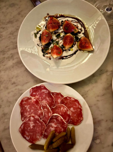 Two plates of figs with stracciatella and saucisson sec