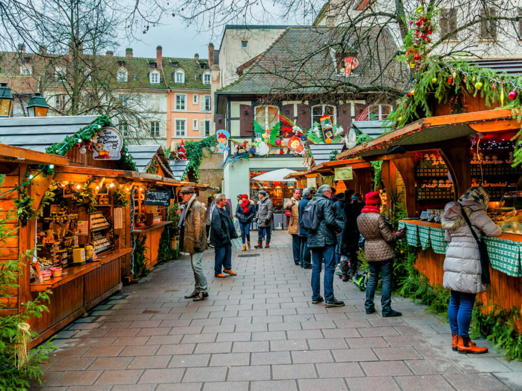 Shoppers looking at some products at the Strasbourg Christmas Market