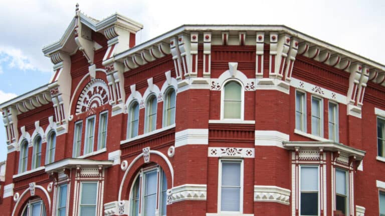 Top view of the architectural red and white exterior of Strater Hotel