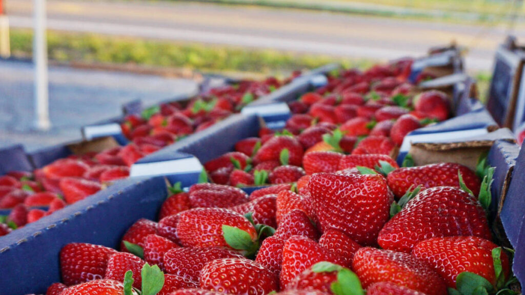 Close up view of strawberries on a market