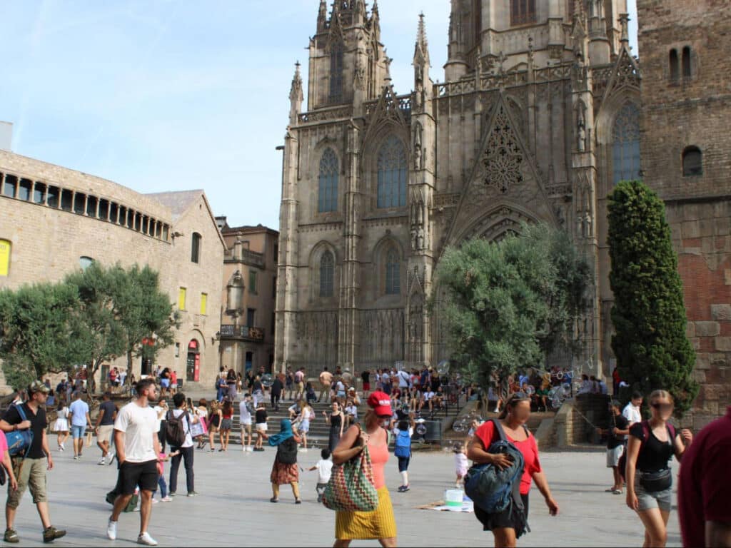 View of people passing by the Barcelona Cathedral