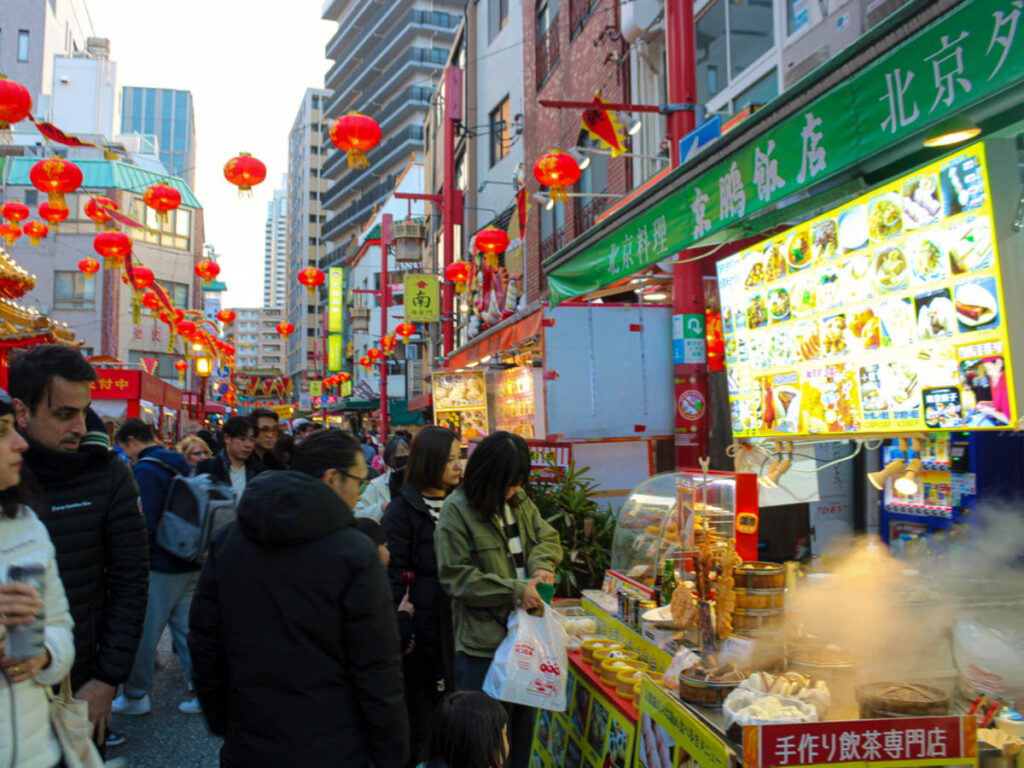 People looking and buying the Street foods in Kobe