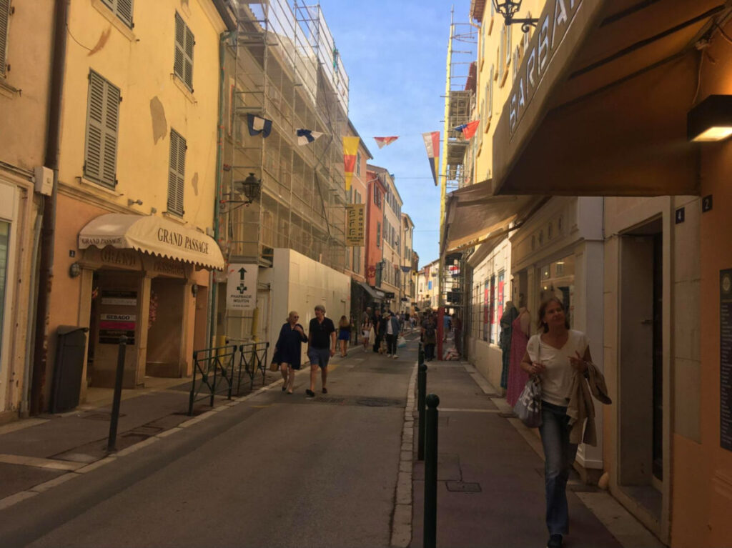 People walking in a street in La Bourgade