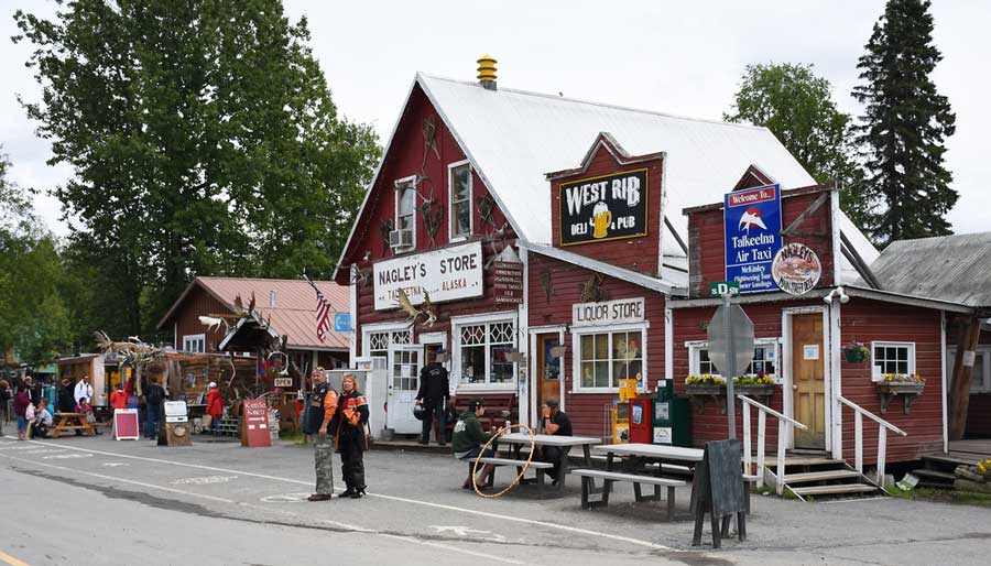 View of people and establishments from a street in Talkeetna