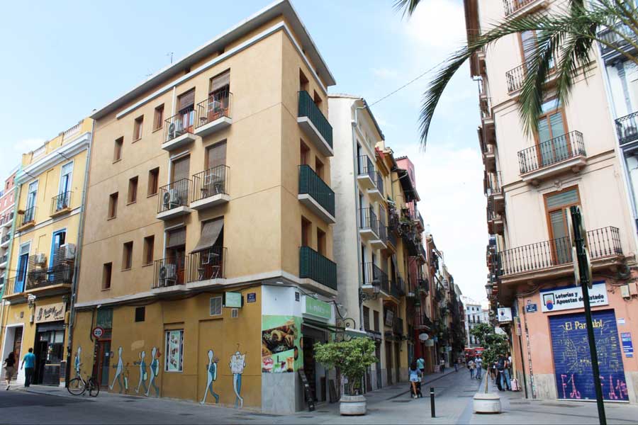 View of colorful buildings on a street in Valencia