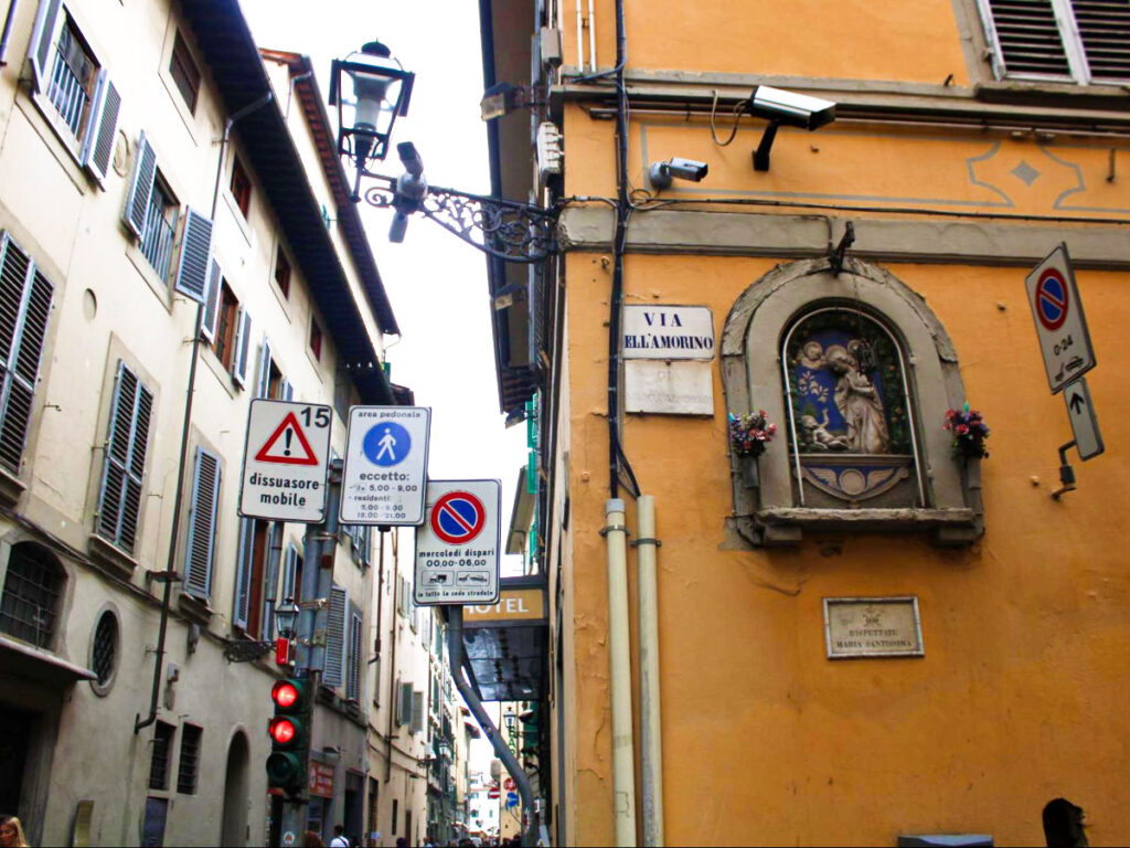 View of the street signs and lights in Florence