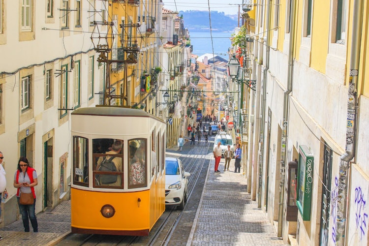 View of a yellow streetcar in Lisbon