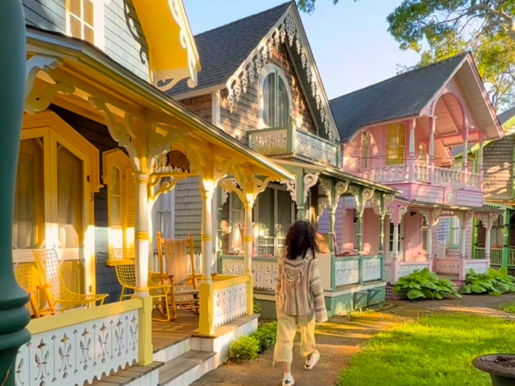 A woman strolling through the Oak Bluffs neighborhood in Martha’s Vineyard