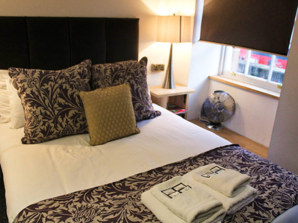 The large bed and small space inside the studio