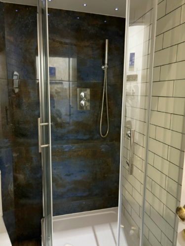 The large shower area of the studio