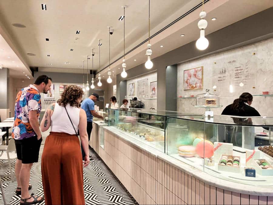 View of the people checking out the sweets display at the Sucre