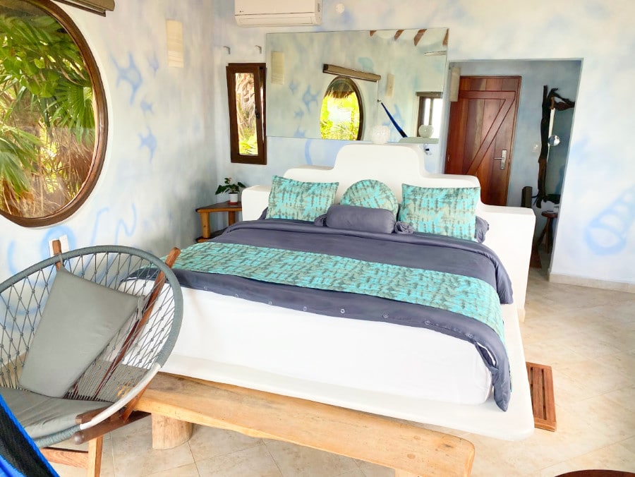 View of the interior of a bedroom in Suenos Tulum Hotel
