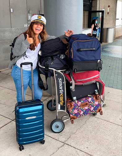 The author's wife with their bags and suitcase