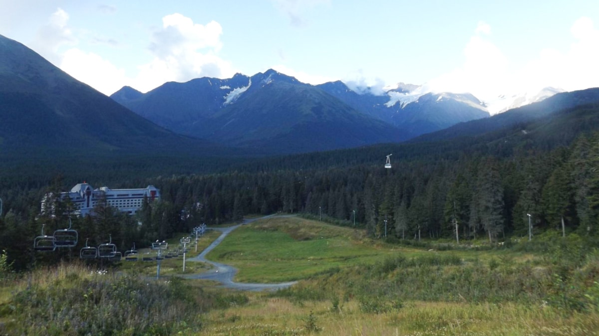 Overlooking view of the mountain valleys and ski lift of Alyeska in summer