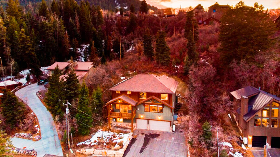 Aerial view of the Summit Hike accommodation surrounded by greenery at dusk