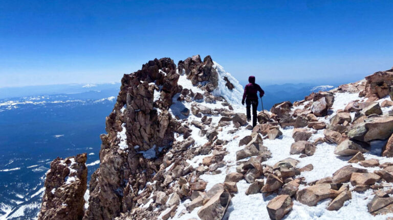 The author McKenna Mobley, hiking on the summit of Mount Shasta