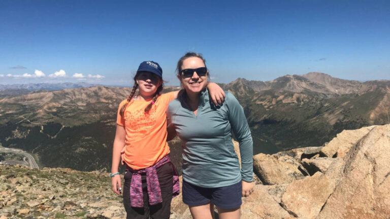 The author, Laura Falin with her daughter at the summit of Mount Sniktau