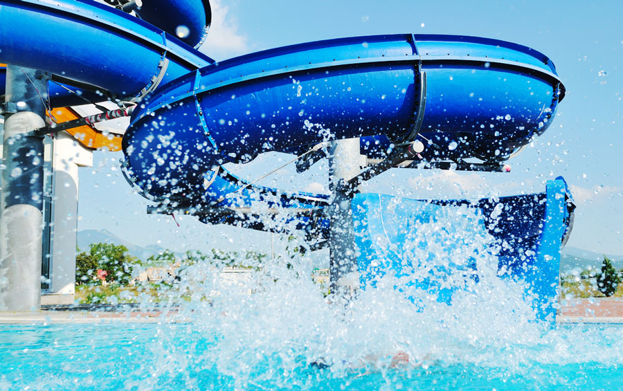 View of a water slide on a outdoor pool
