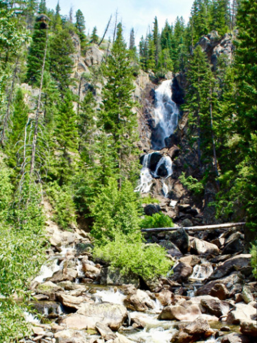 View of the Fish Creek Falls from the bottom on a sunny day