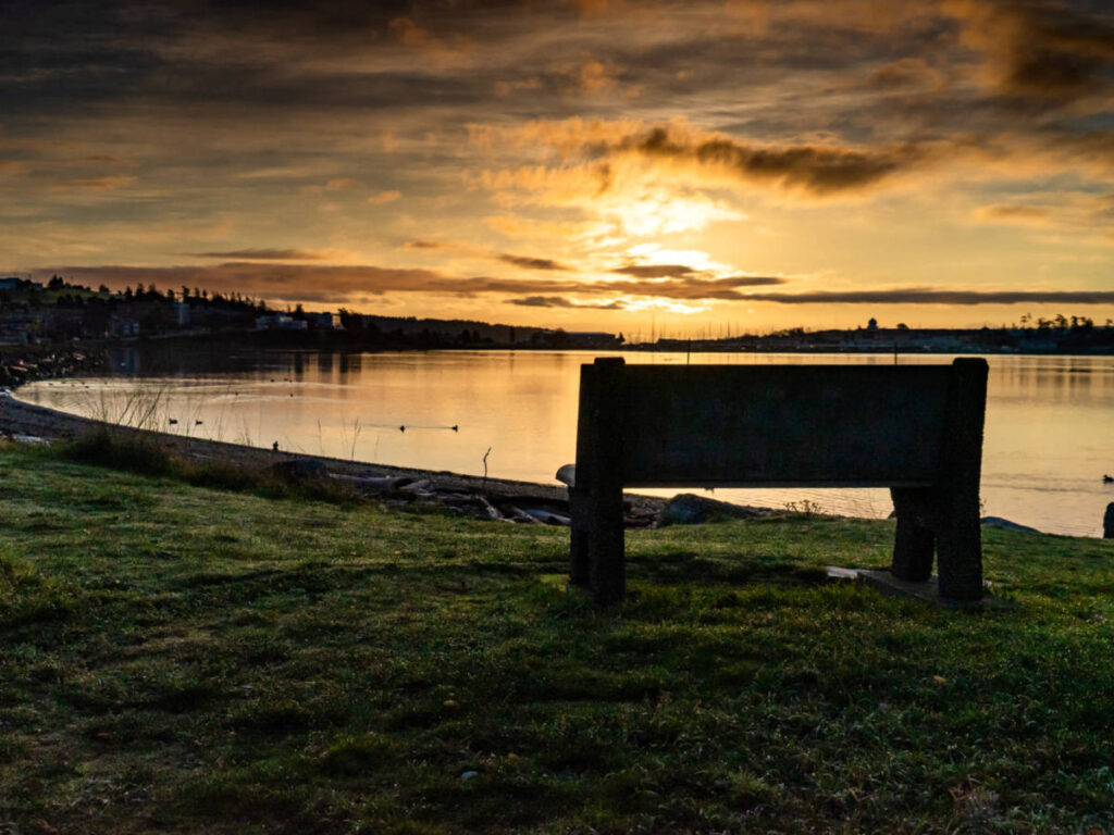 Sunset over a park bench near the Oak Harbor