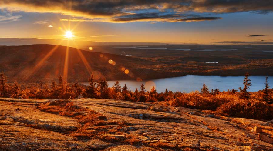 View of the sun rising in the Cadillac Mountain