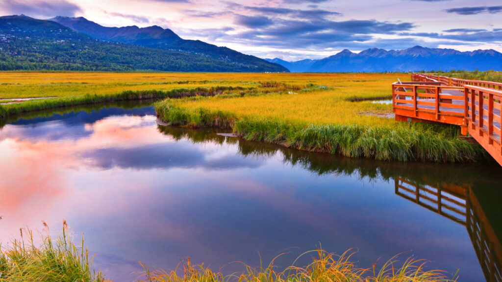 Scenic view of the Potter Marsh Bird Sanctuary with the red boardwalk at sunrise