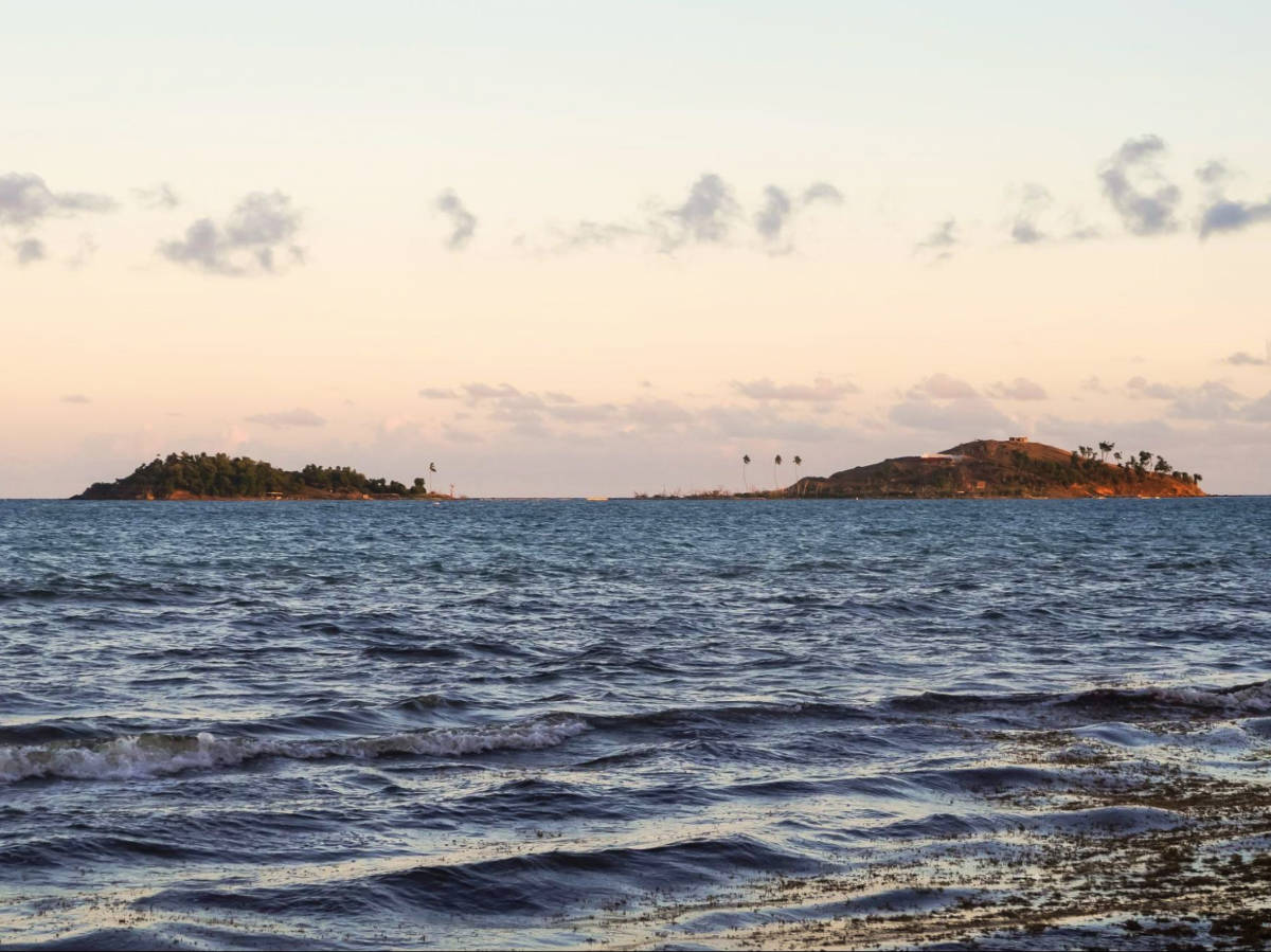 Scenic mountain views from the beach of Cayo Santiago at sunset