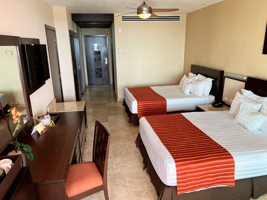 View of two beds in a room in Sunset Plaza Beach resort