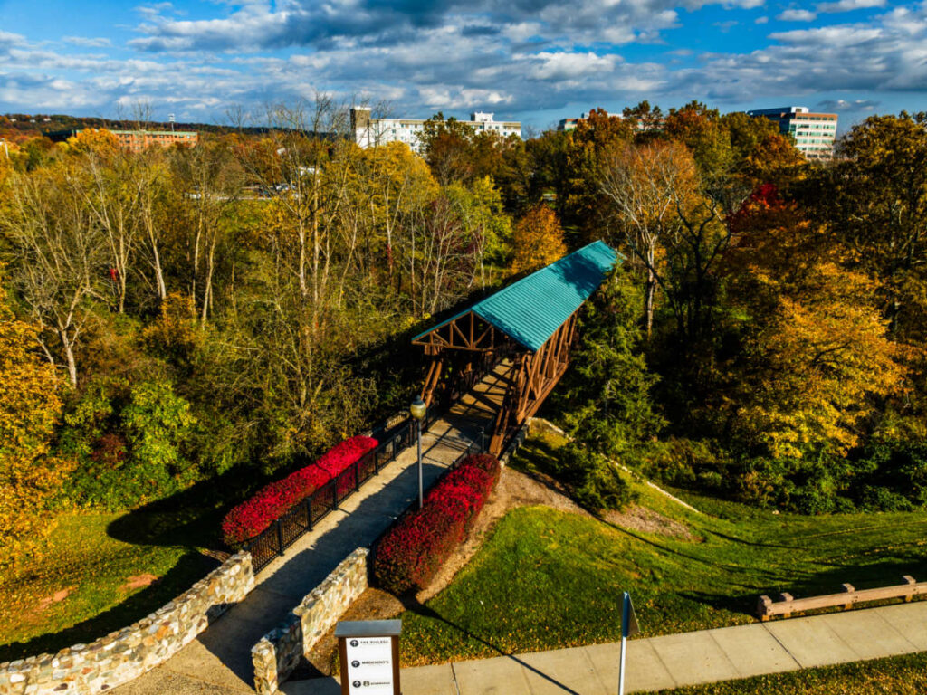 Aerial view of the bridge in the middle of the lush park in Bridgewater at sunset