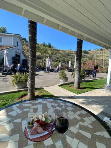 A charcuterie and a glass of wine at the Sunshine Mountain Vineyard