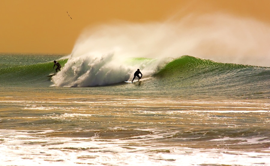 Two surfers having fun at San Clemente State Beach