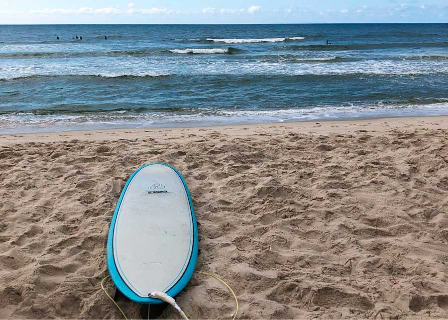 A surf board on the sand of Fire Island