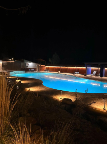 View of the illuminated pool at night