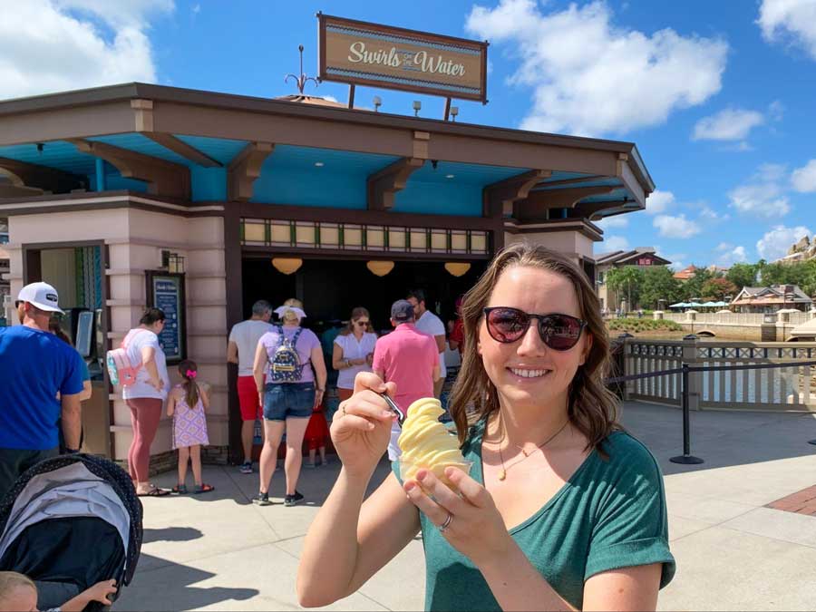 The author enjoying her classic pineapple DOLE whip from Swirls on the Water